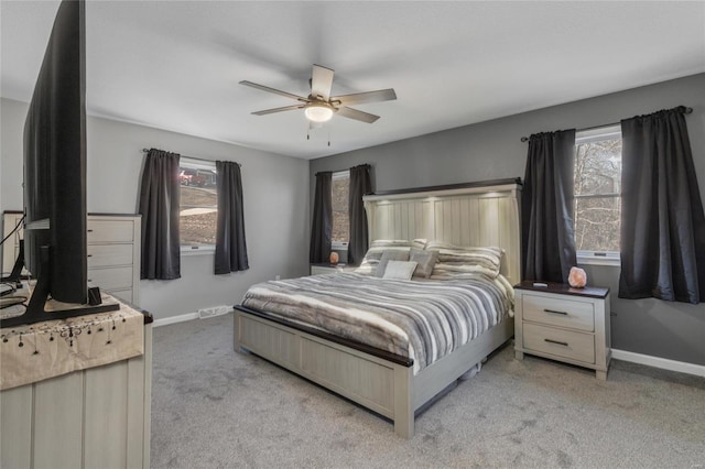 bedroom featuring ceiling fan and light colored carpet