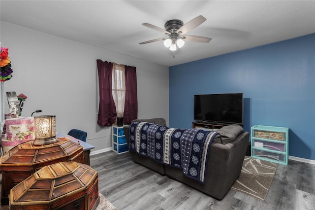 interior space with ceiling fan and wood-type flooring