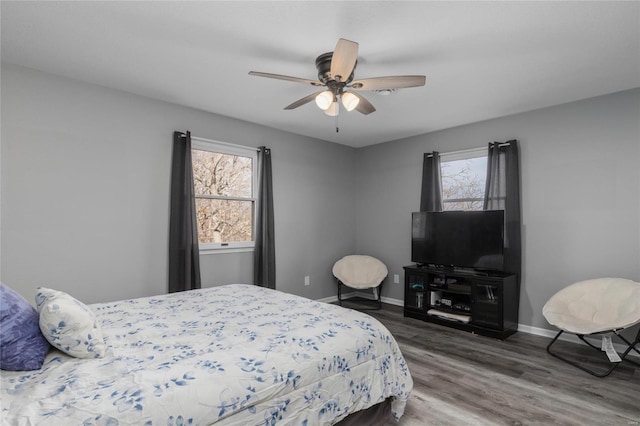 bedroom featuring dark hardwood / wood-style floors and ceiling fan