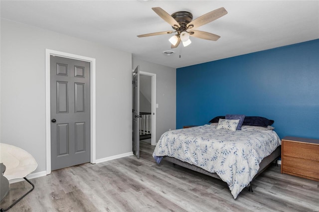 bedroom featuring hardwood / wood-style flooring and ceiling fan