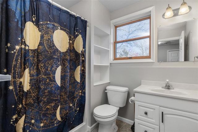 bathroom featuring walk in shower, vanity, and toilet