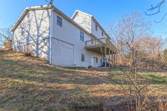 rear view of property featuring a balcony