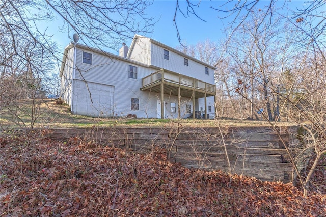 back of property featuring a deck