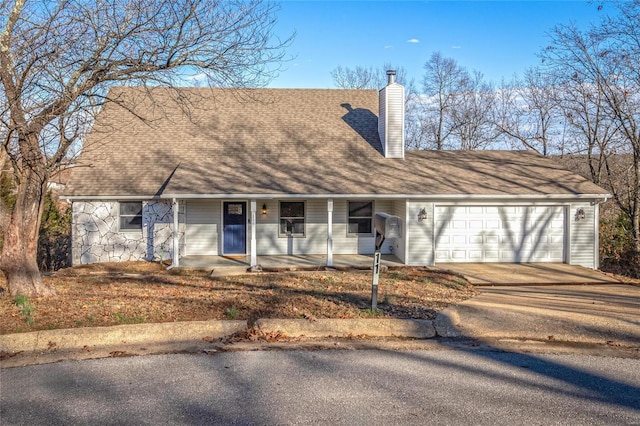 view of front of home featuring covered porch and a garage