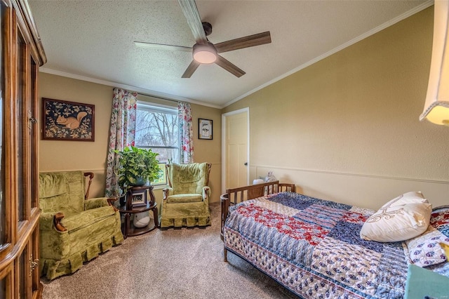 bedroom with ceiling fan, crown molding, carpet floors, and a textured ceiling