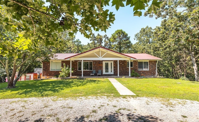 single story home with a porch and a front yard