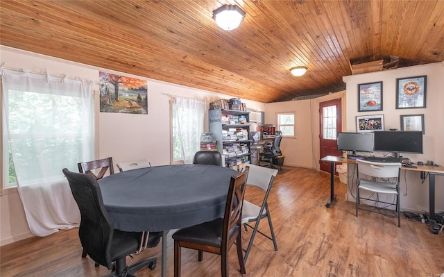 dining area featuring wooden ceiling, lofted ceiling, and light hardwood / wood-style floors