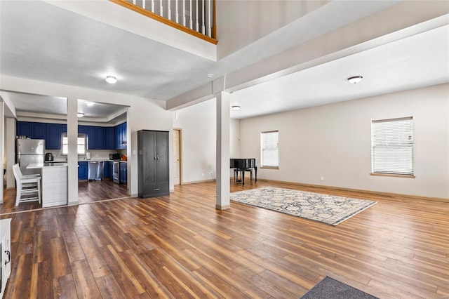 unfurnished living room featuring dark hardwood / wood-style flooring