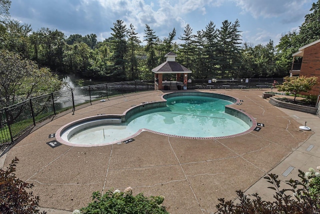 view of swimming pool featuring a gazebo and a patio