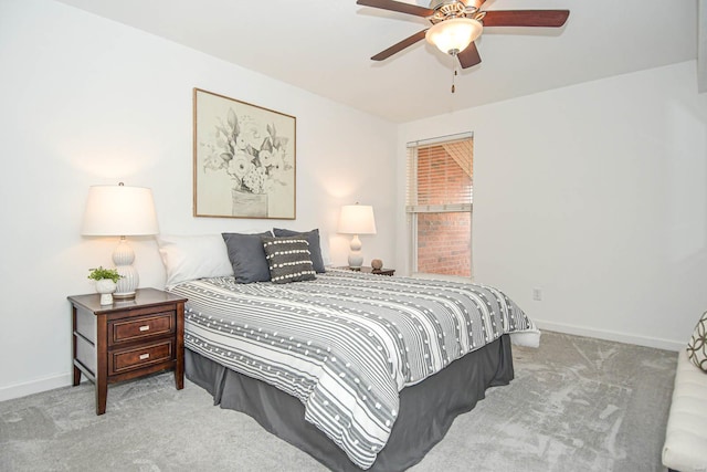 bedroom with ceiling fan and light colored carpet