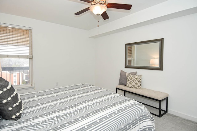 bedroom with ceiling fan and light colored carpet