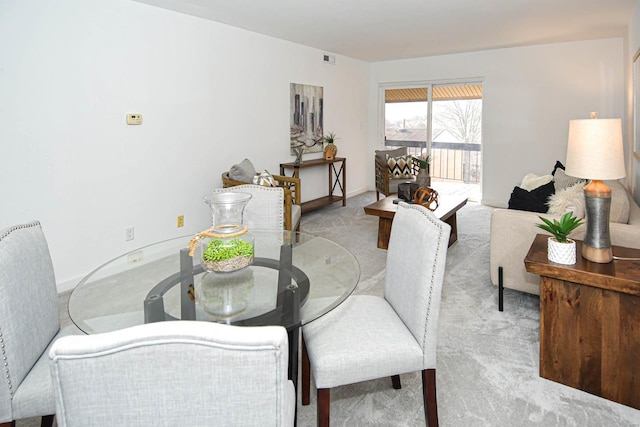 view of carpeted dining space