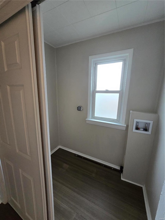 clothes washing area with washer hookup and dark wood-type flooring