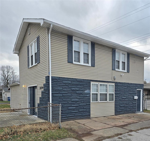 view of side of property with a patio area