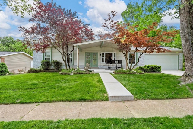 view of front of house with a front lawn, a porch, and a garage