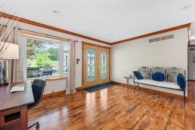 interior space featuring crown molding, french doors, and hardwood / wood-style flooring