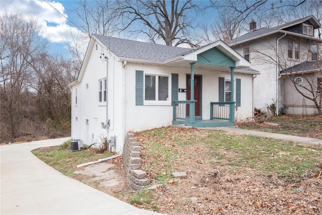 view of front of house with a porch and central AC unit