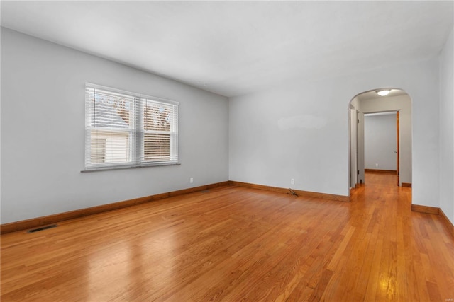 spare room featuring light hardwood / wood-style flooring