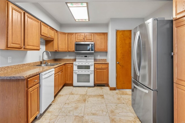 kitchen with appliances with stainless steel finishes and sink