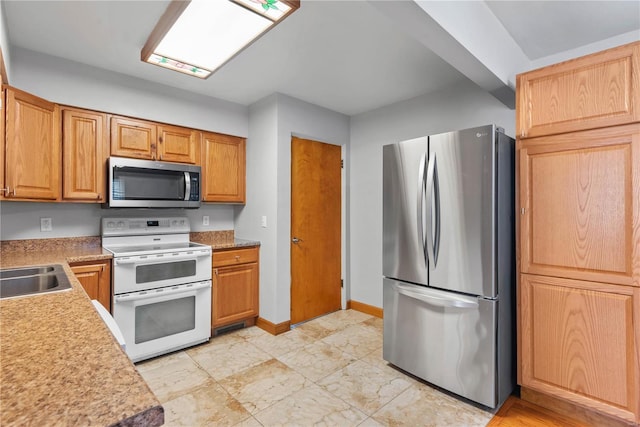 kitchen featuring sink and appliances with stainless steel finishes