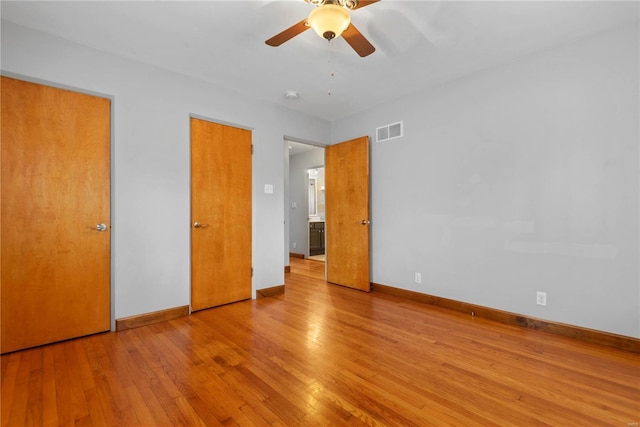 unfurnished bedroom featuring ceiling fan and light hardwood / wood-style flooring