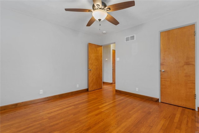 unfurnished room featuring ceiling fan and light hardwood / wood-style flooring