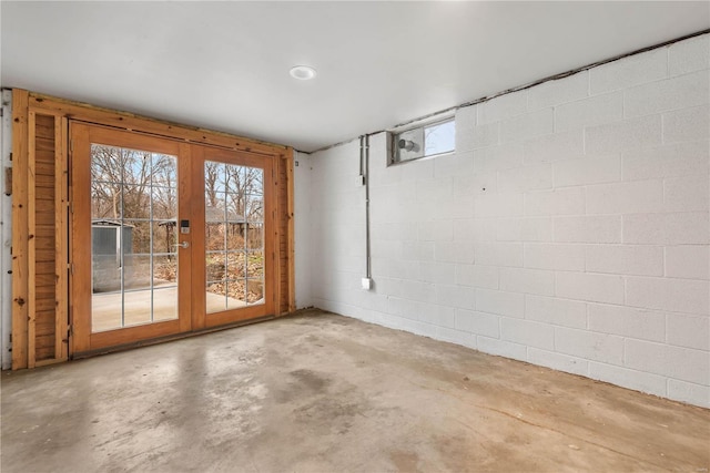 interior space with concrete flooring and french doors