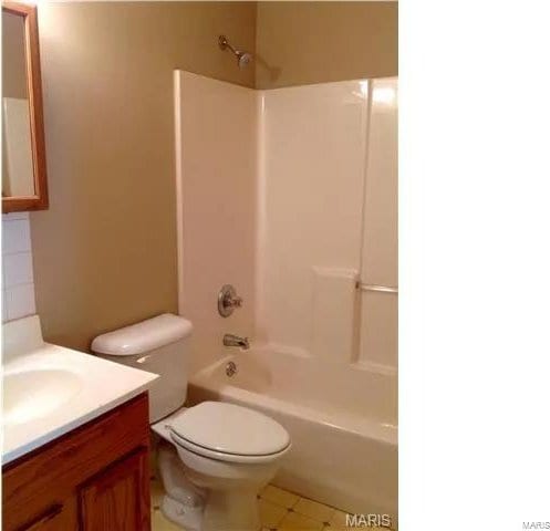 full bathroom featuring vanity, shower / bathtub combination, and toilet