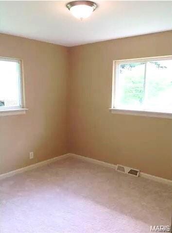 empty room with carpet flooring