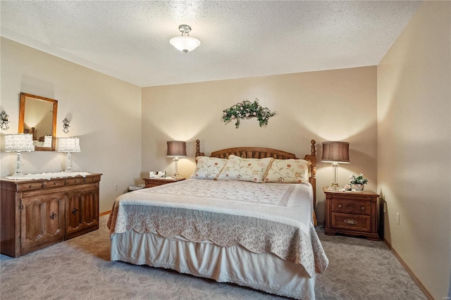 carpeted bedroom featuring a textured ceiling