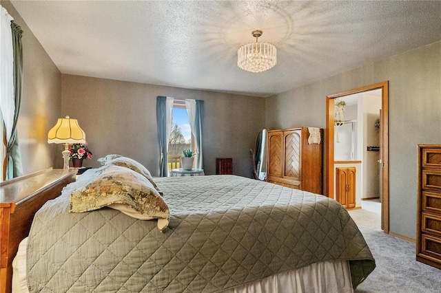 carpeted bedroom with a textured ceiling and a chandelier