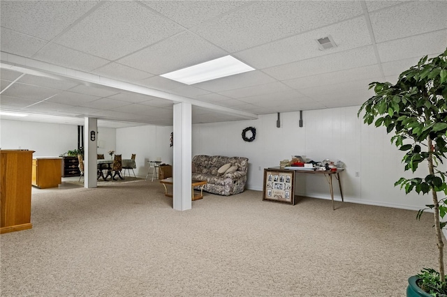 basement with carpet flooring and a drop ceiling