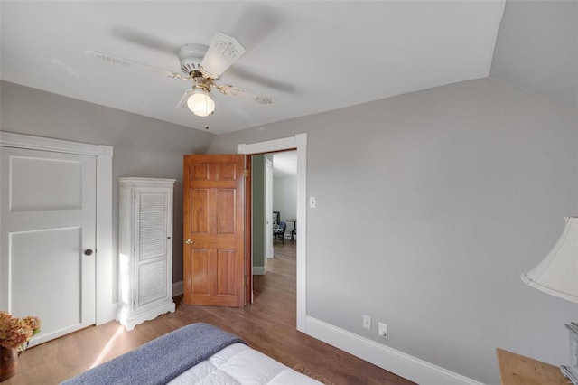 bedroom featuring lofted ceiling, hardwood / wood-style floors, and ceiling fan