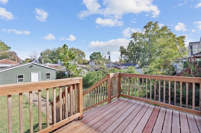 wooden terrace with a yard