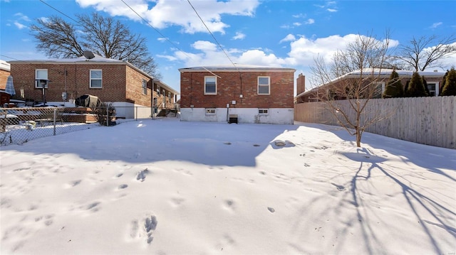 view of snow covered house