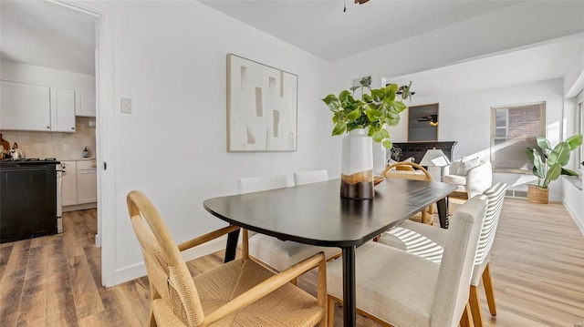 dining area with light hardwood / wood-style flooring