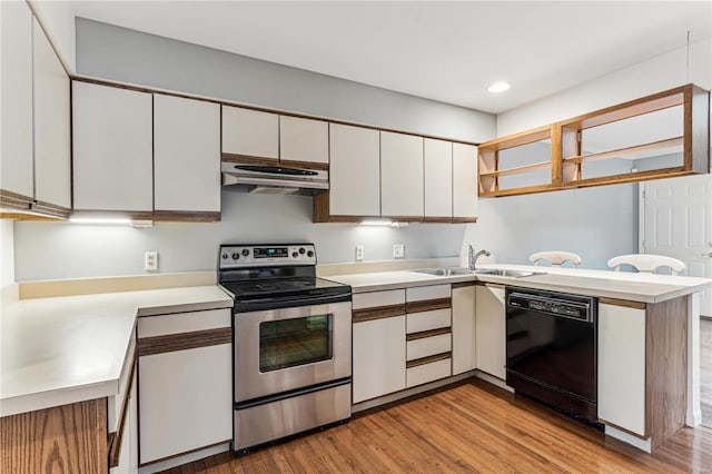 kitchen featuring kitchen peninsula, white cabinets, sink, dishwasher, and stainless steel electric range