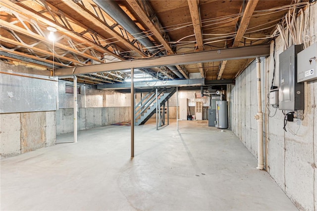 basement with gas water heater and electric panel