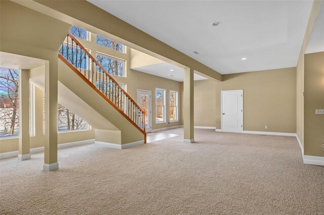 interior space with recessed lighting, stairway, baseboards, and carpet