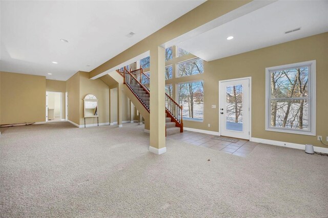 interior space with visible vents, baseboards, carpet, stairs, and recessed lighting