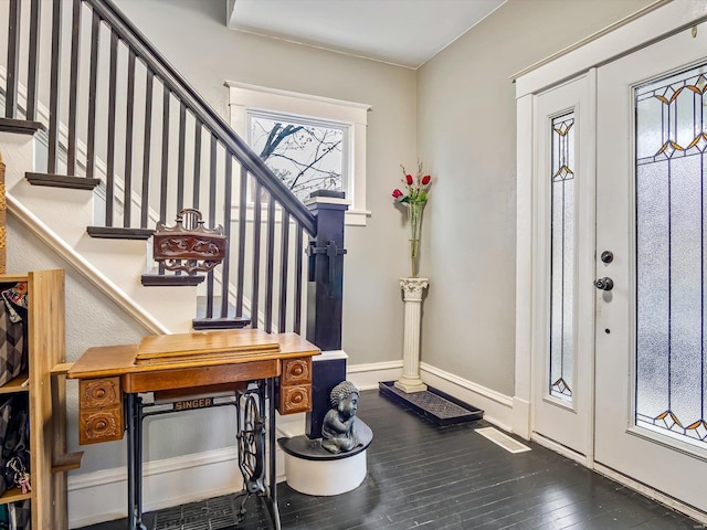 foyer with dark hardwood / wood-style floors