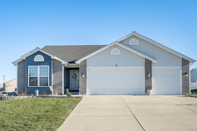 single story home featuring a garage and a front lawn