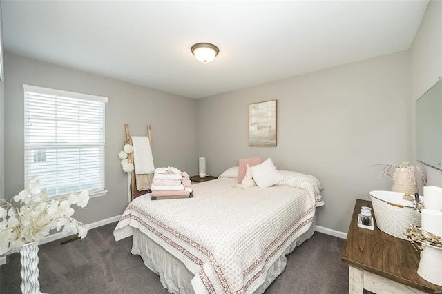 bedroom with dark carpet