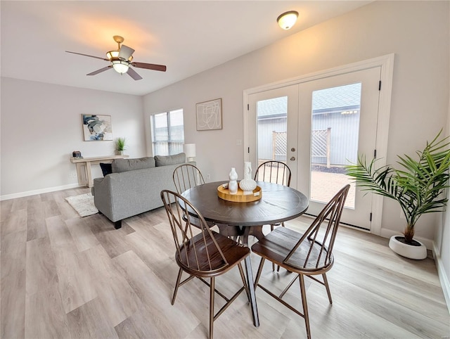 dining space featuring ceiling fan, french doors, and light hardwood / wood-style flooring