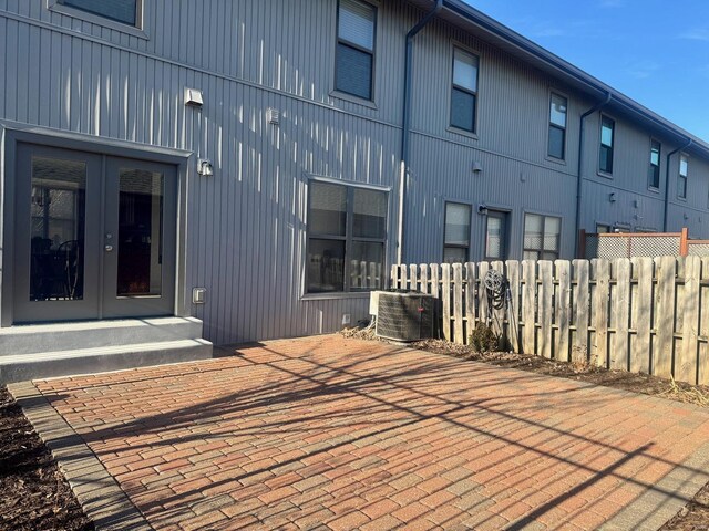 exterior space featuring french doors and central AC unit