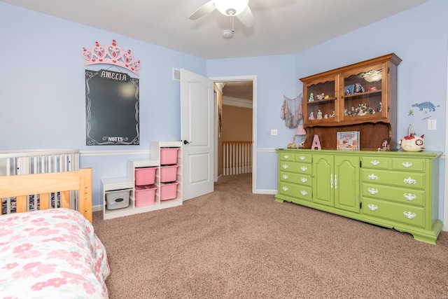 bedroom featuring light carpet, ceiling fan, and crown molding