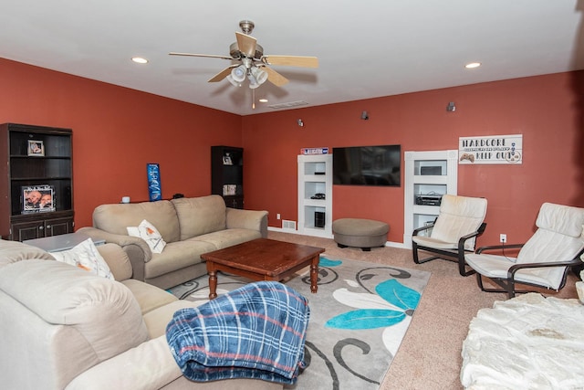 carpeted living room featuring ceiling fan