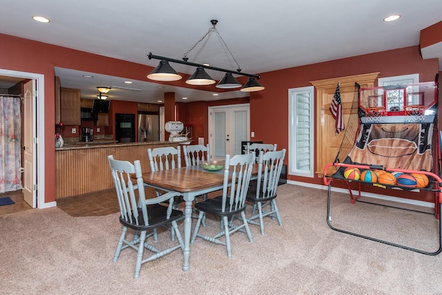 view of carpeted dining area