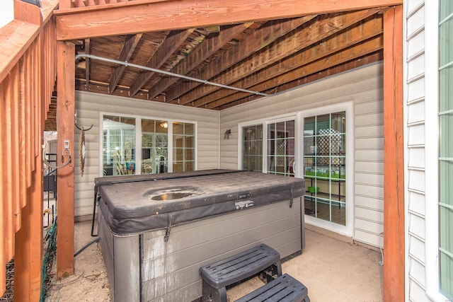 view of patio / terrace with a hot tub