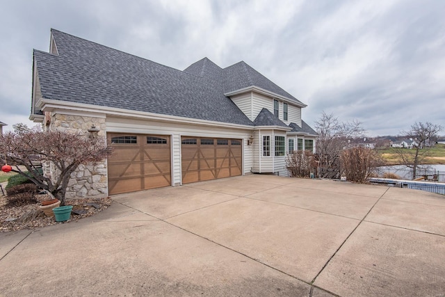 view of side of property featuring a garage